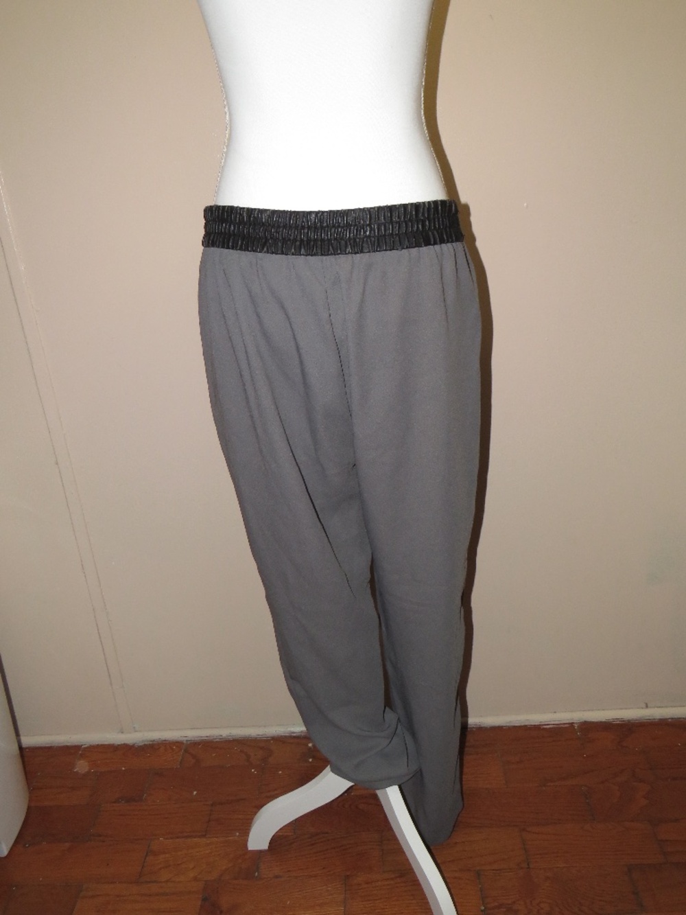 Banana Republic grey pants feature a black faux-leather waistband, Size 12